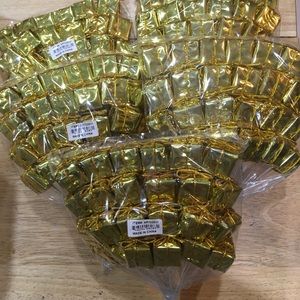120 small gold presents, staked packages, for wreaths and decorations.